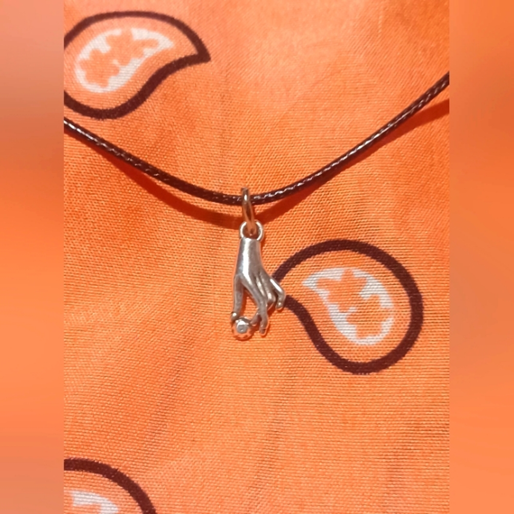 Black cord necklace with hand charm